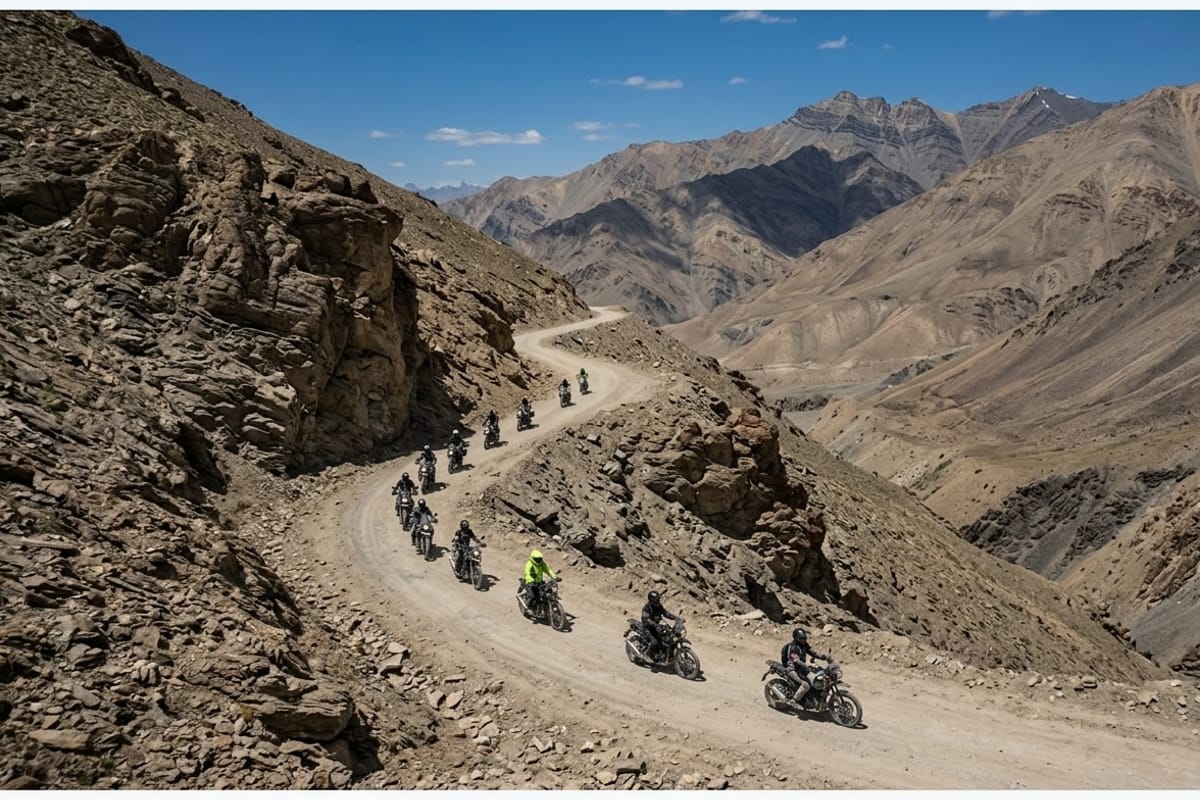 Bike convoy on a winding Ladakh mountain road, multi-day circuits require you to be self-sufficient with puncture kits, tools, and spare fuel