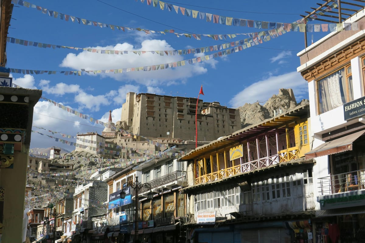 Leh market bazaar with the Palace in the background, woollen socks, Diamox, pashmina stoles and Nubra apricots are all readily available here