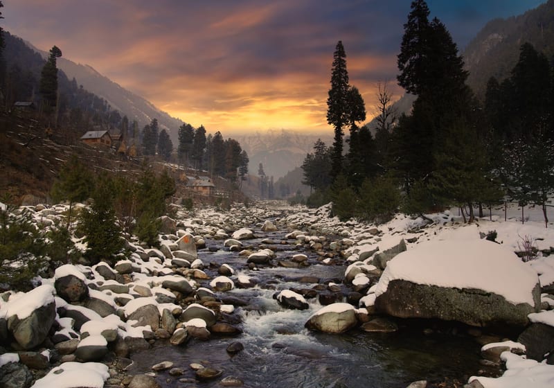 Green alpine meadow at Pahalgam with the Lidder river, summer is when Kashmir's meadows are at their lush best
