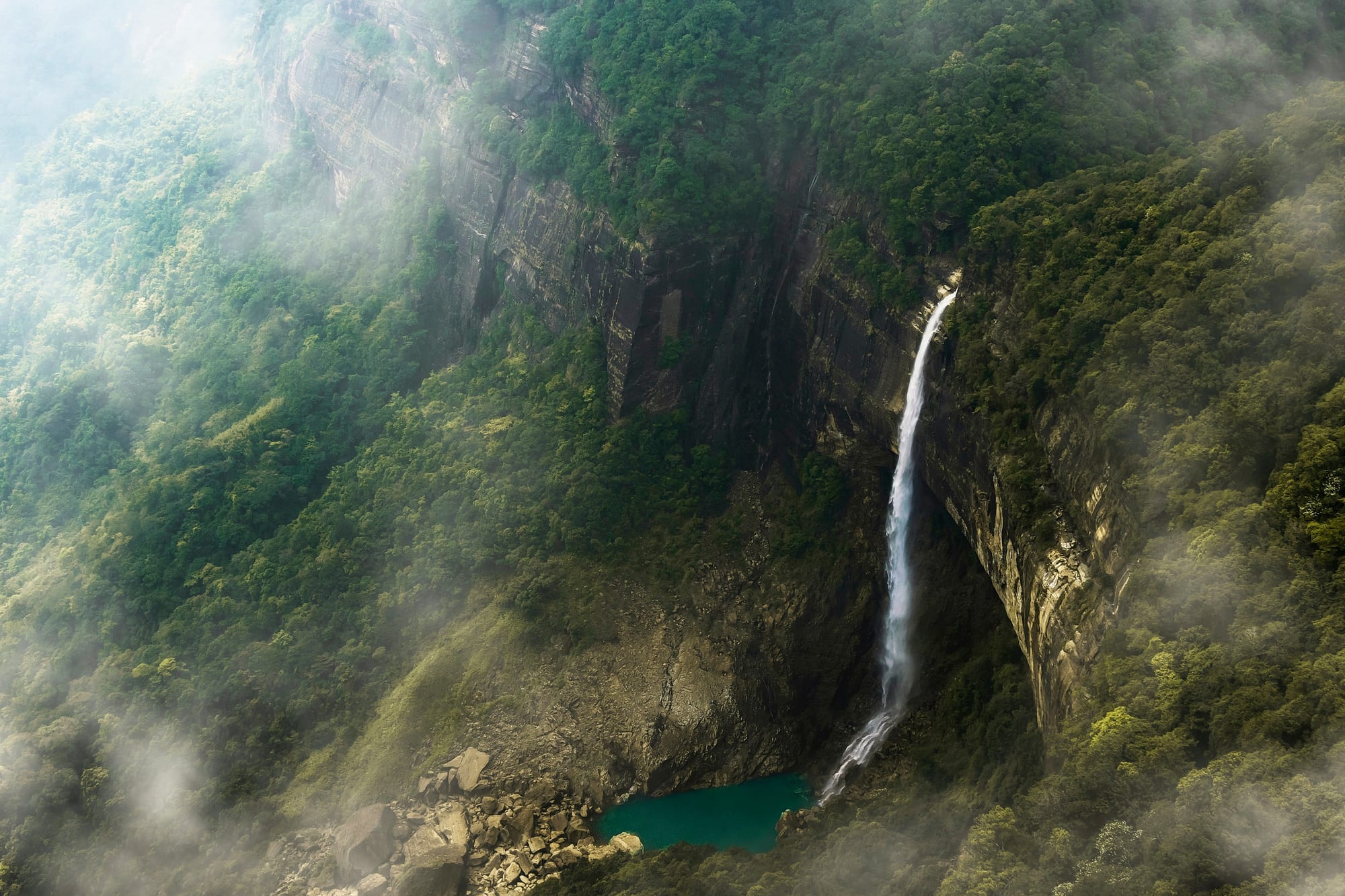Nohkalikai Falls plunging into a deep green pool near Cherrapunji